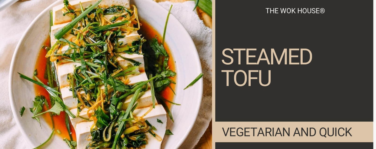 Silken tofu slices topped with shredded ginger, spring onion and coriander in soy sauce on a white plate