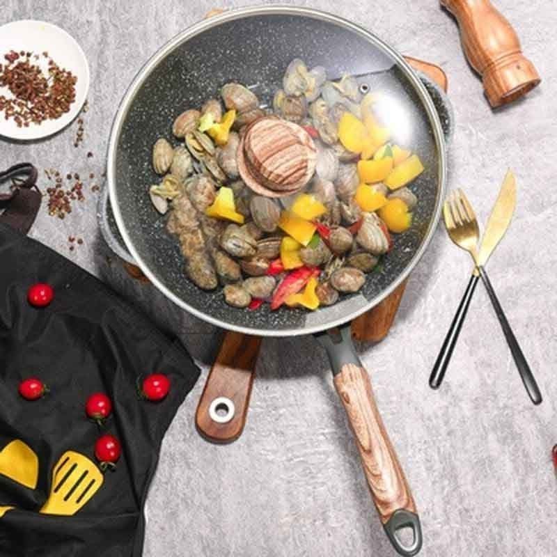 Aso granite wok with glass lid and wooden handle on induction cooktop