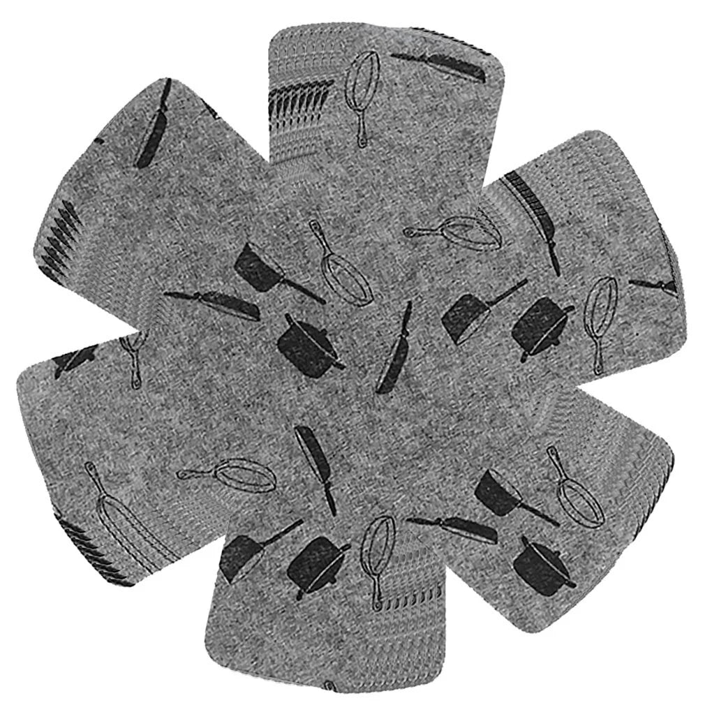 Set of 8 fabric protectors stacked between woks to prevent scratches