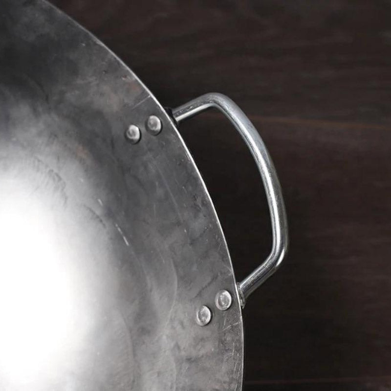Gassan hand-forged iron wok with round bottom and wooden handle