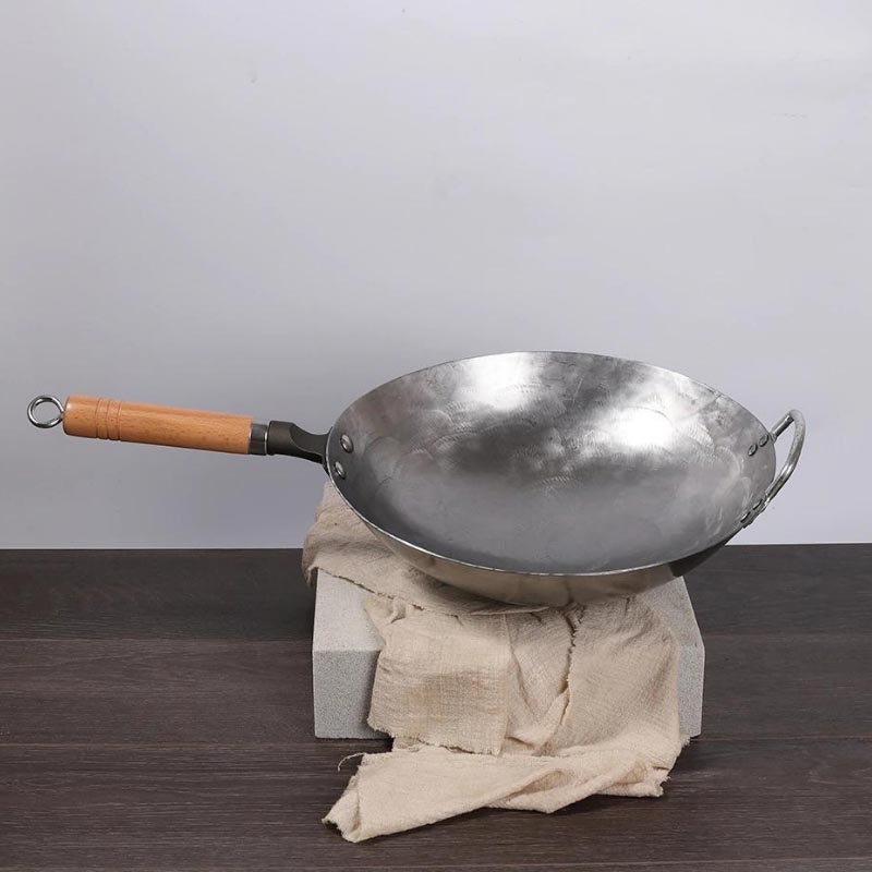 Gassan hand-forged iron wok with round bottom and wooden handle