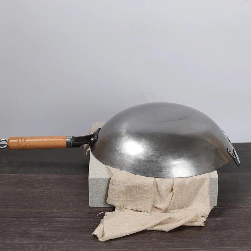 Gassan hand-forged iron wok with round bottom and wooden handle